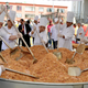 Chefs gather around a giant wok to cook the world´s largest fried rice